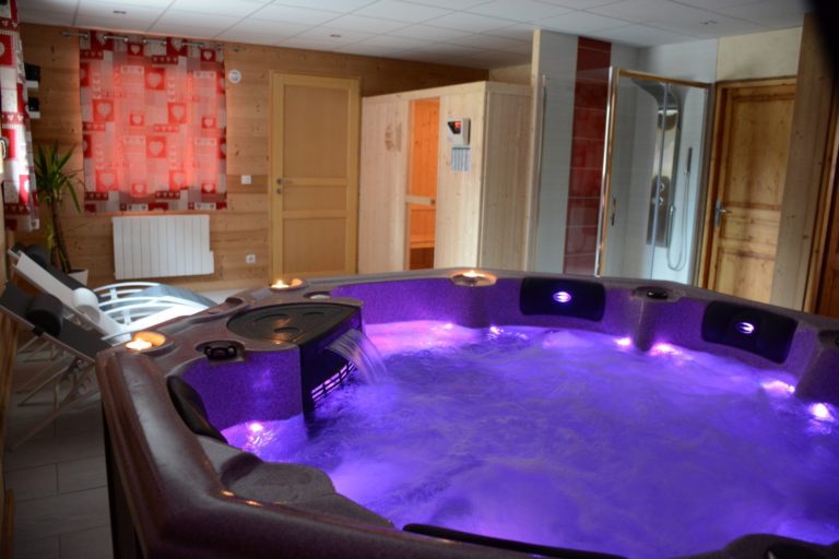 wellness area with hot tub and sauna