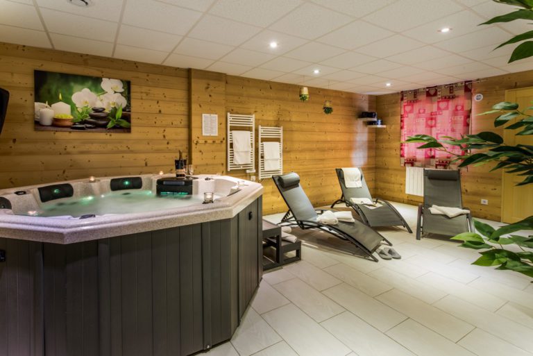 wellness area with hot tub and sauna