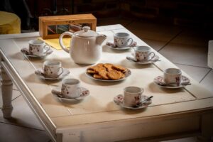 Tea time: table with cups and tea pot